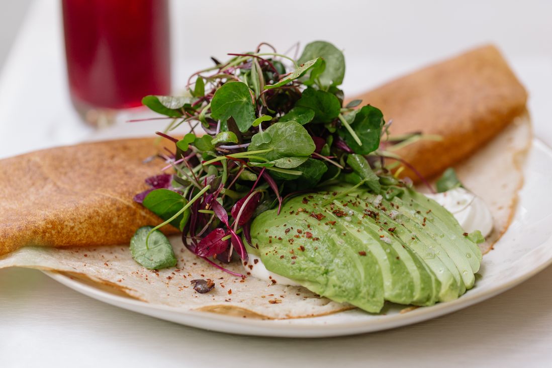 Dosa with yogurt, avocado and sprouts<br>